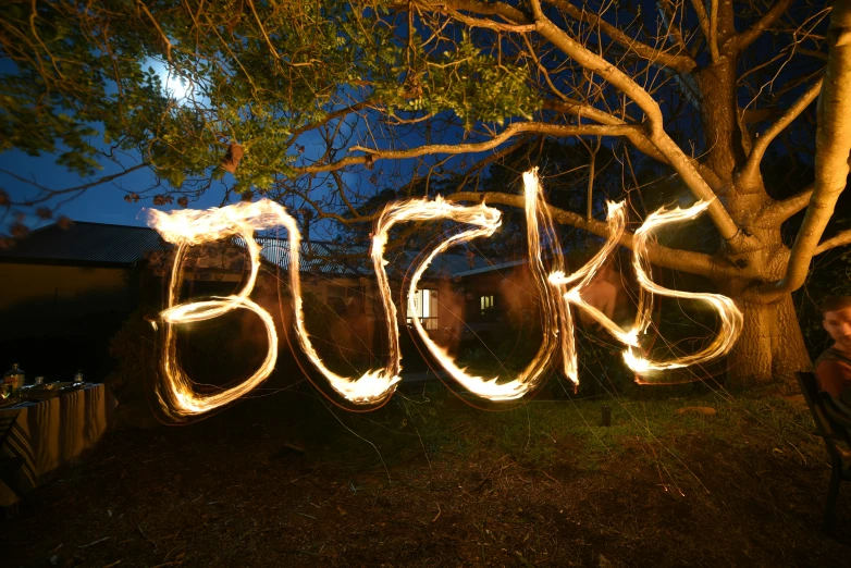 a group of people doing soing light painting