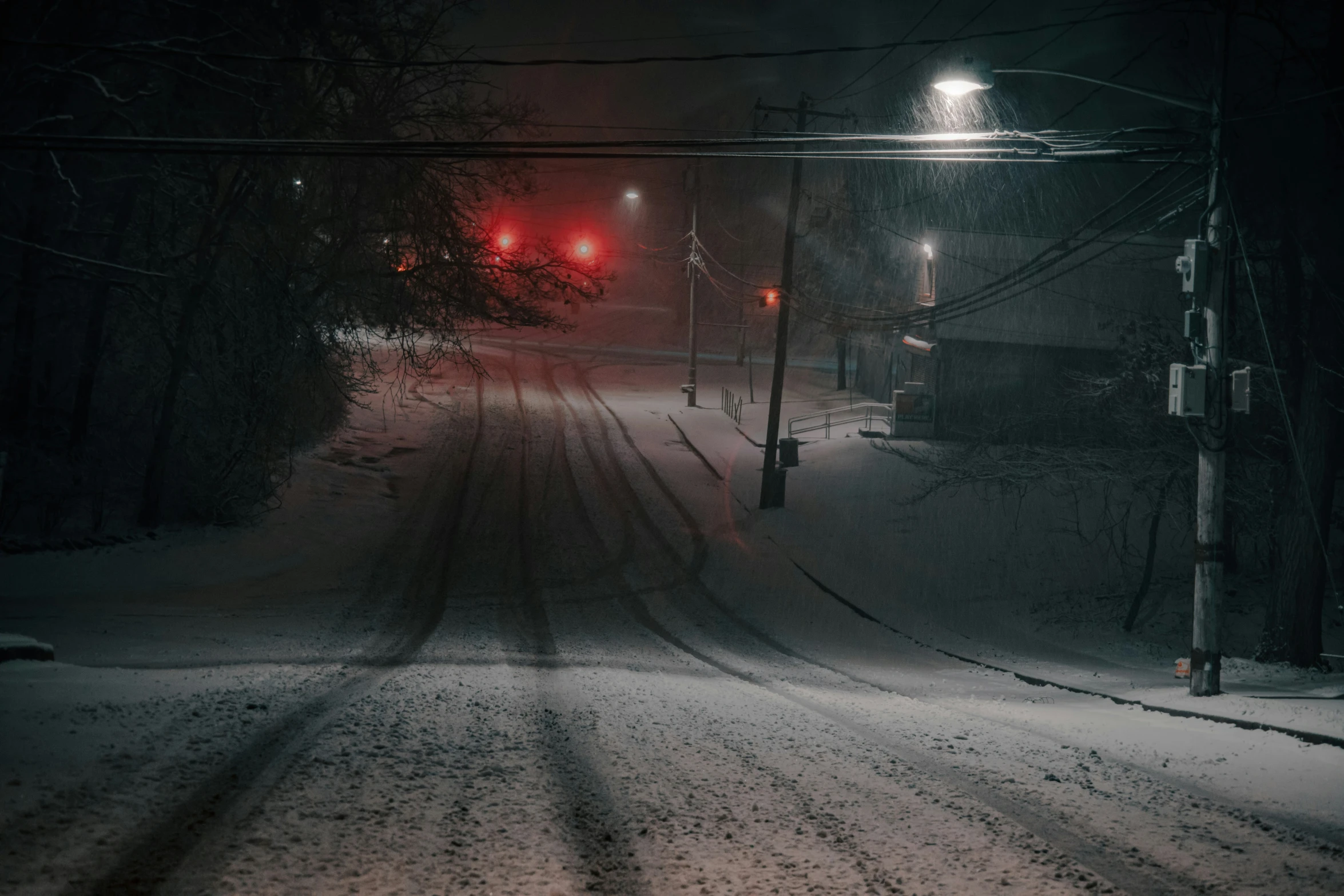 a streetlight that is in the middle of some snow