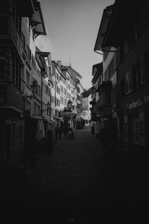 an empty street with many balconies and houses