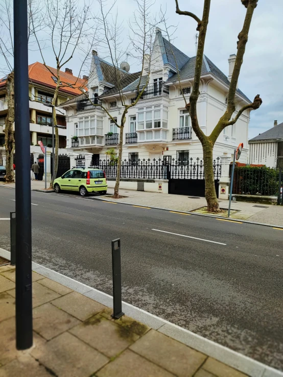 a street view of some large white buildings