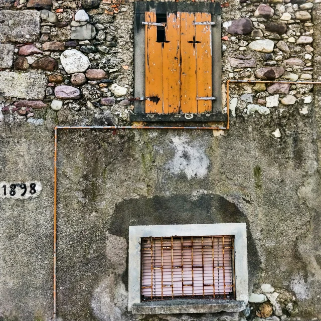 a window with bars on it and a gate out front