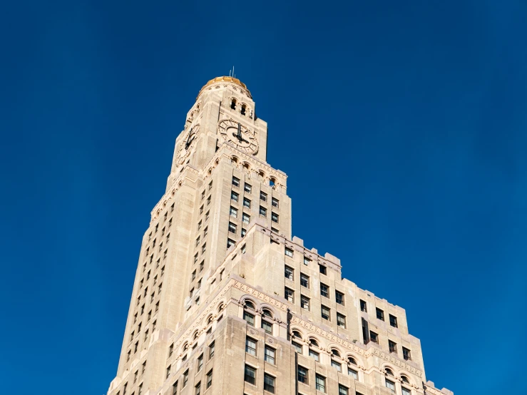 the view of a tall building and its sky background