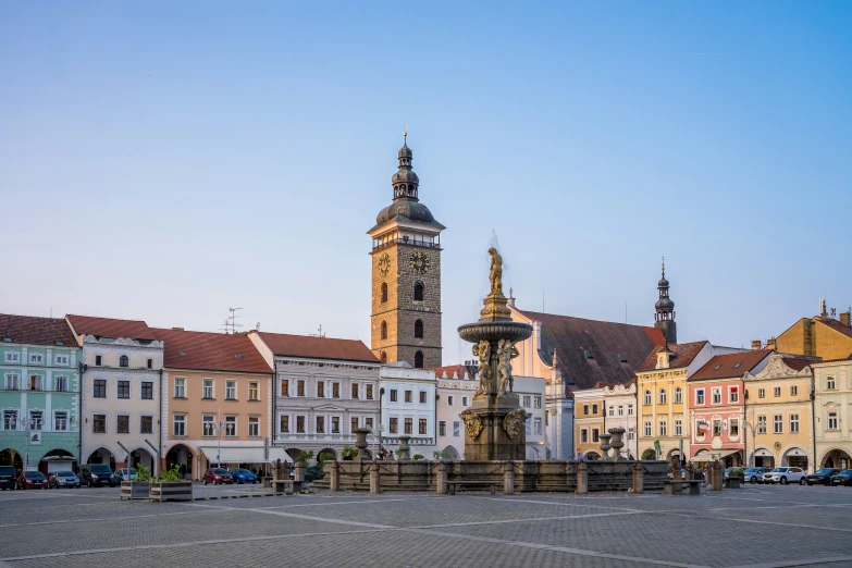 a tower rises above a city street and shows off it's architecture