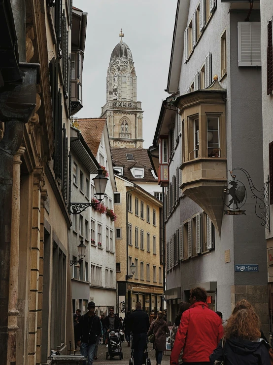 a city with many people walking down it