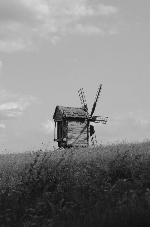 windmill in black and white with cloudy sky