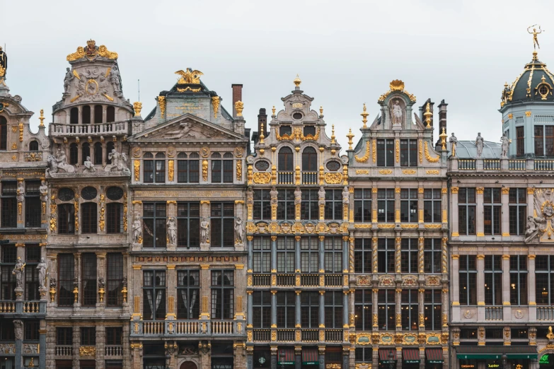 there are many beautiful old buildings next to each other