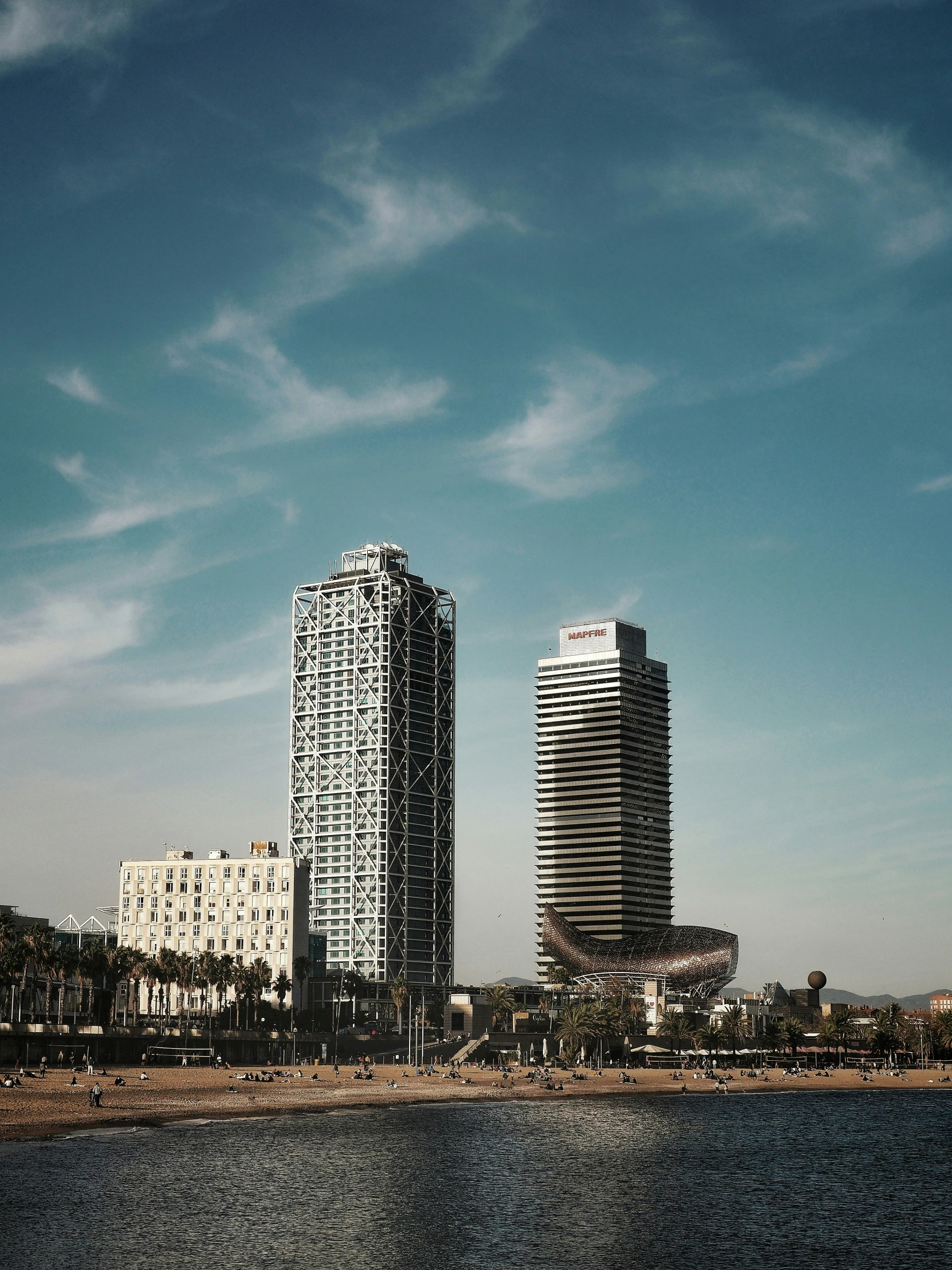 a large body of water next to two buildings