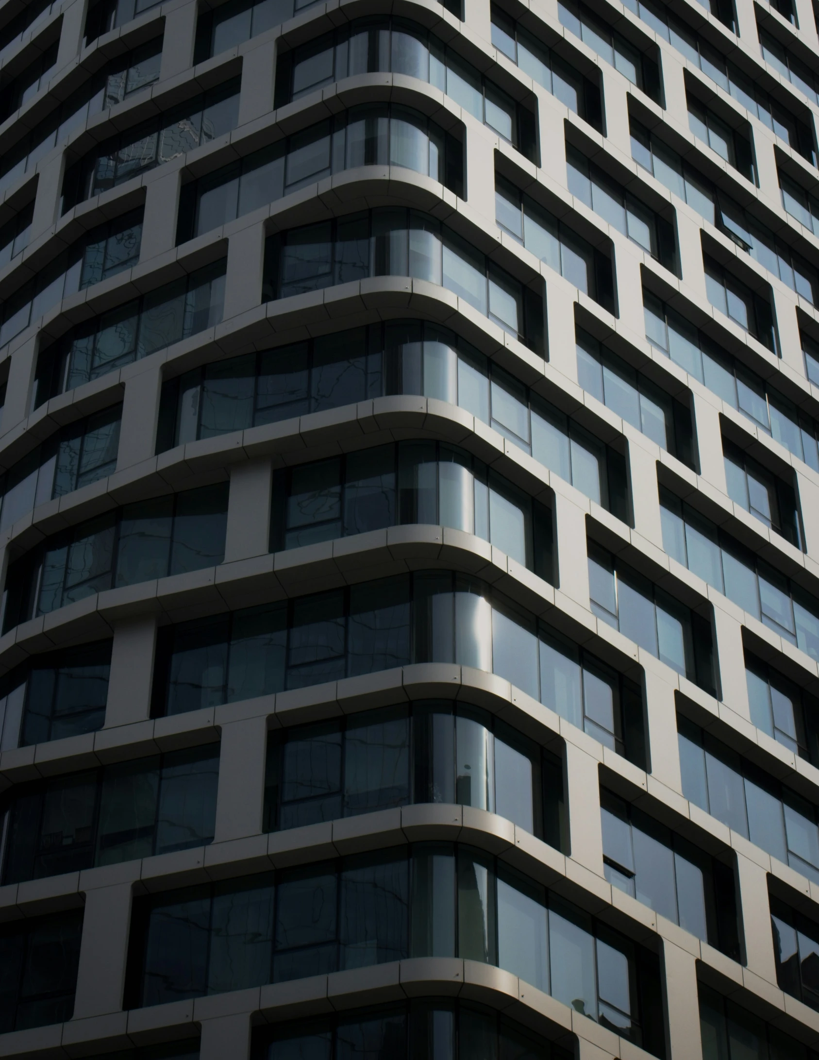 a tall building with an upward glass window