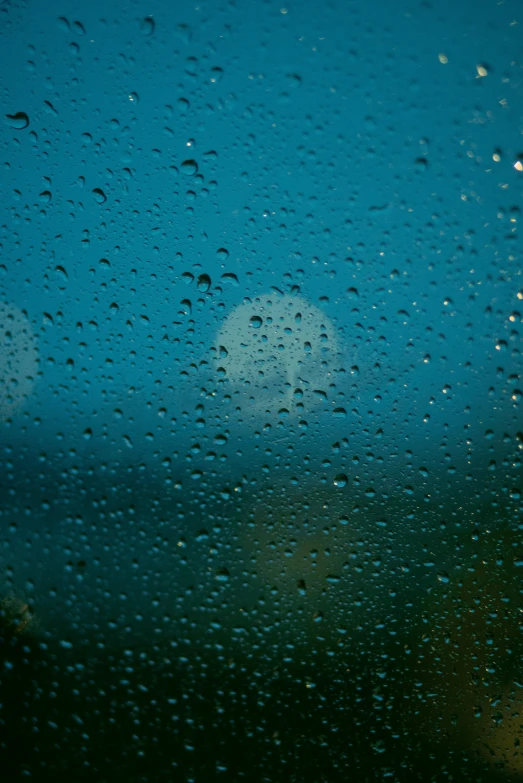 a po of a cloudy sky over the water from a window