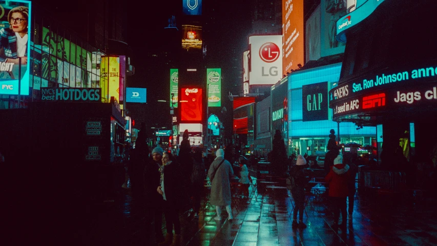 the image shows people walking down the street in the rain