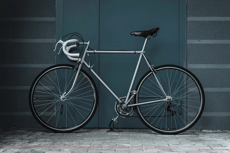 a close up of a bike against a wall