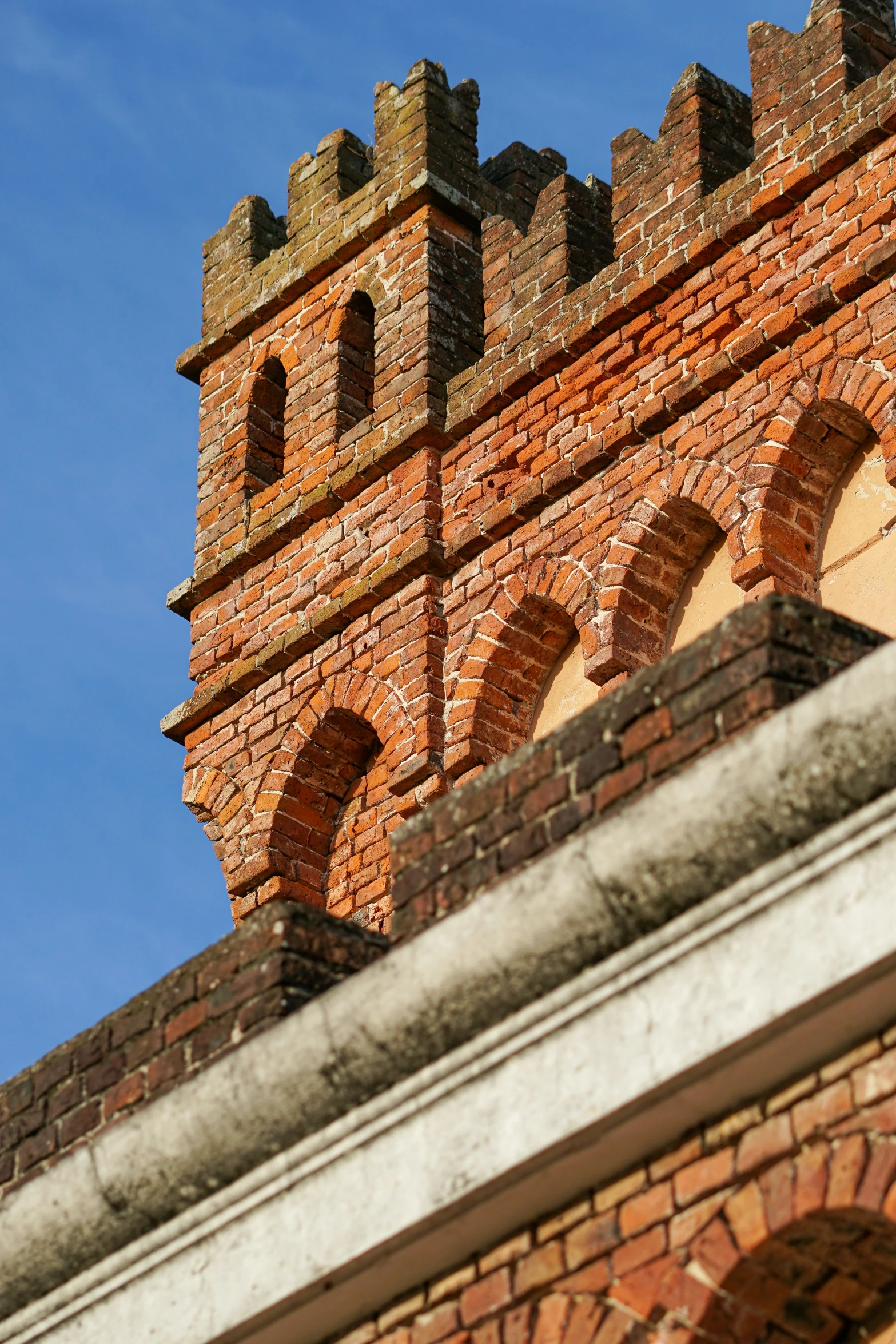 a brick clock tower sitting on top of a building