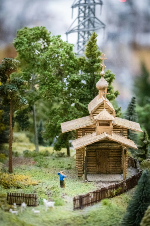 a miniature model church in a plastic box