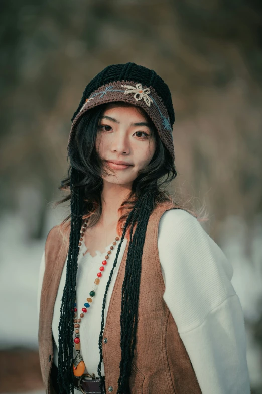 a young asian girl with long, black hair smiles