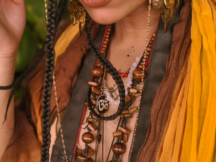 woman dressed in costume with various necklaces and jewelry