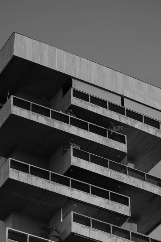a black and white po of a building with balconies