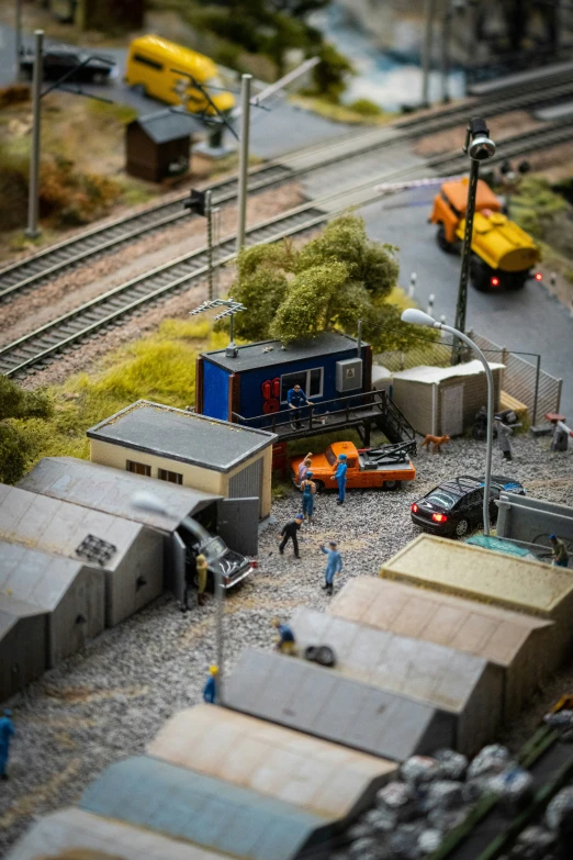 toy train and cars and people in town setting