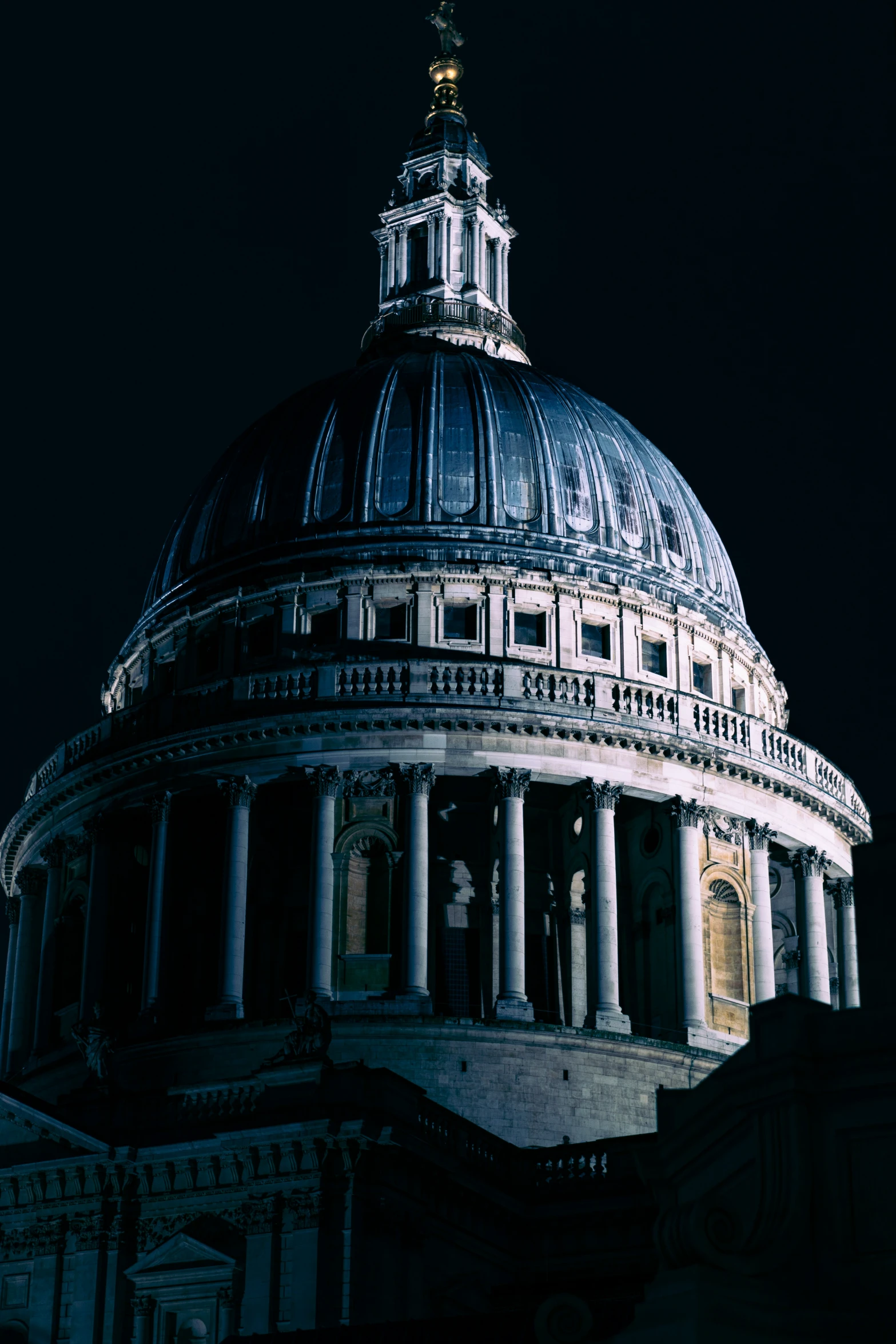 a domed building with columns and a steeple