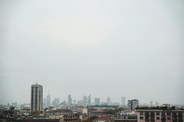 an airplane flying in the sky near a large city