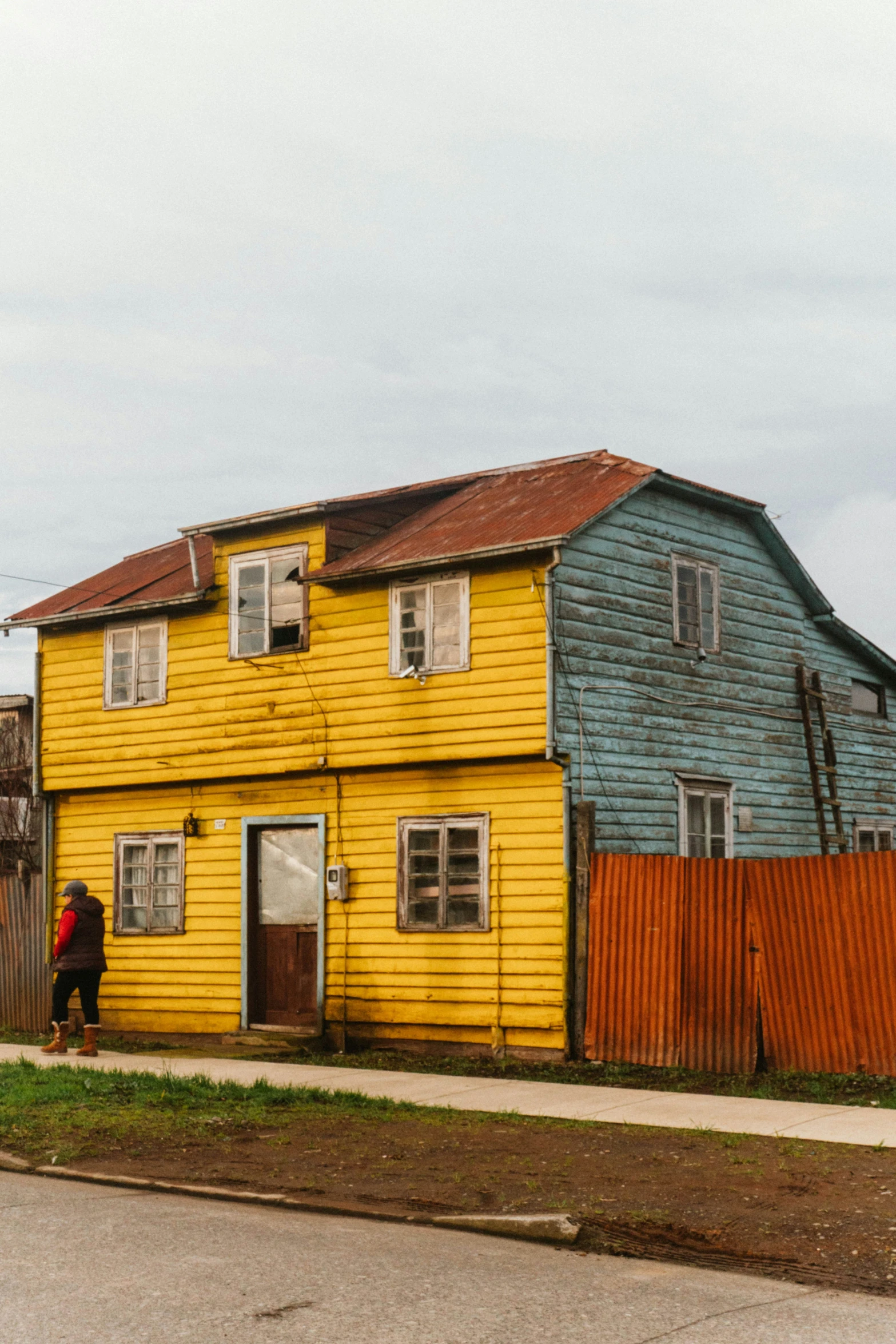 a building with a wooden fence around it