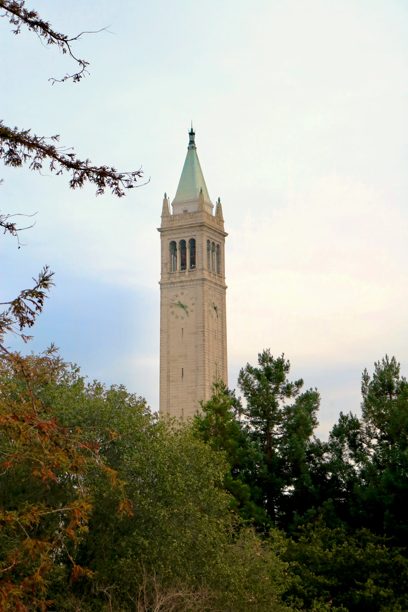 a tower with a clock is shown on the side of the building