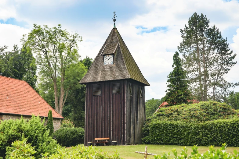 an old wooden church that is situated among greenery