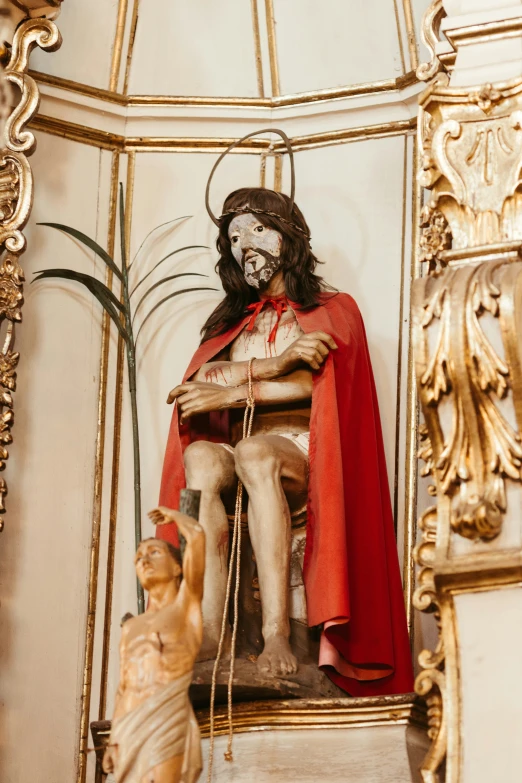 an ornately decorated statue of jesus in a church