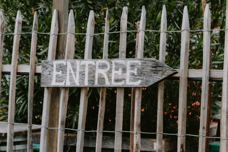 a sign with the word enterprise on it hanging from a fence