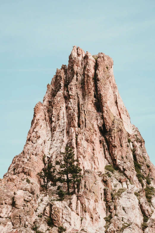 a couple of large rocks on the side of a mountain