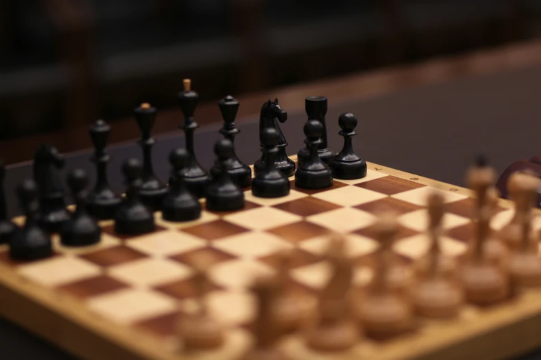 a chess board with pieces cut out on top