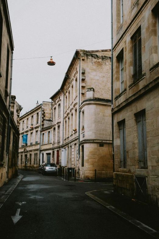 street with many buildings and a hanging light