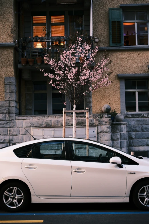 a small car parked next to a building