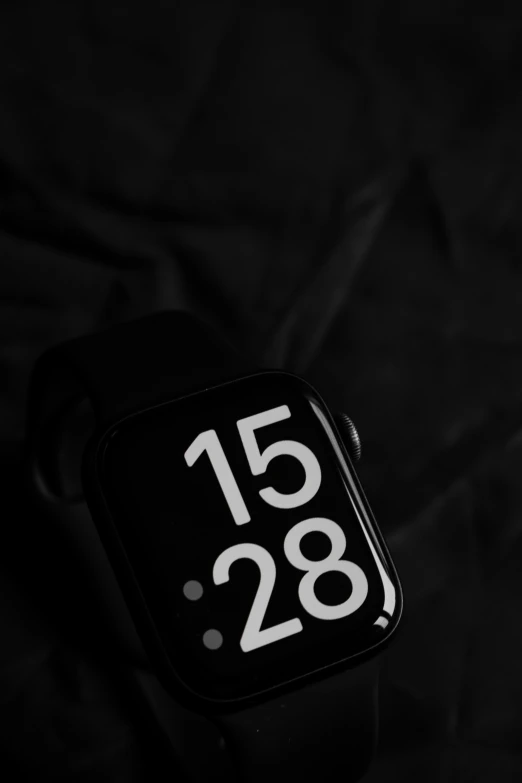 a clock with the date 2053 left on a black cloth