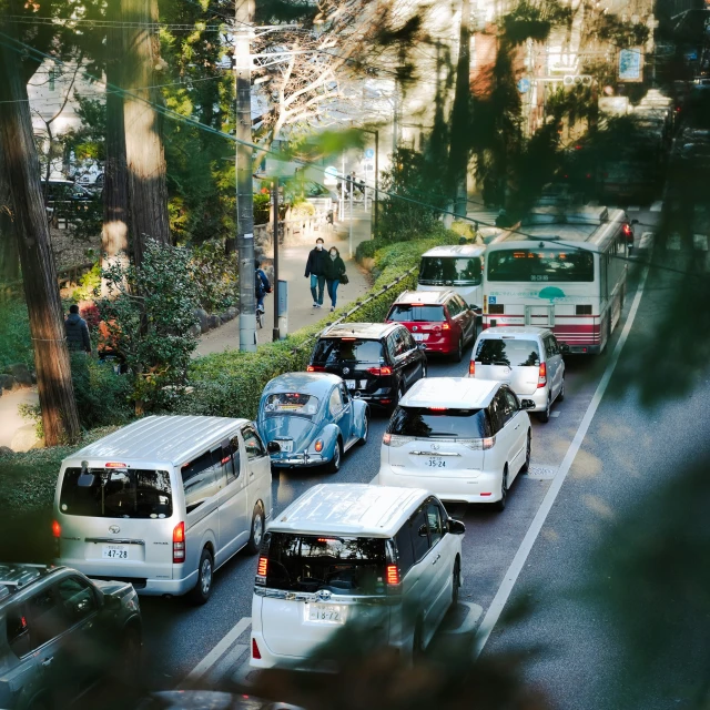 vehicles are driving on the road in traffic