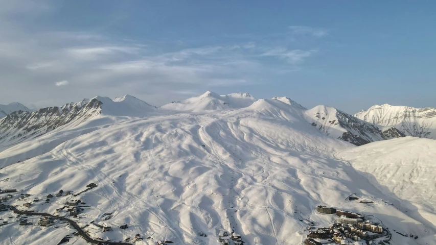 a snow covered mountain is seen in the distance