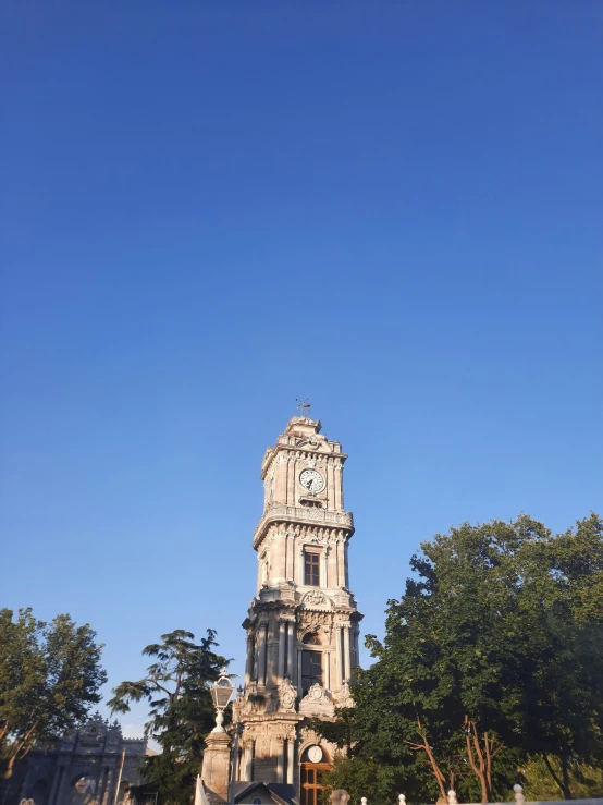 an old looking building with a clock on the tower