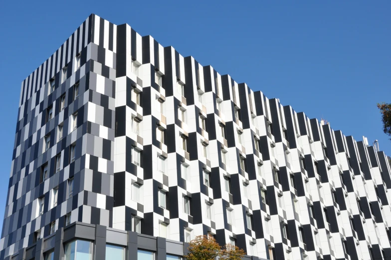 a black and white building on a sunny day