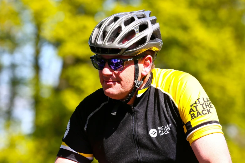 a man wearing a bike helmet and glasses