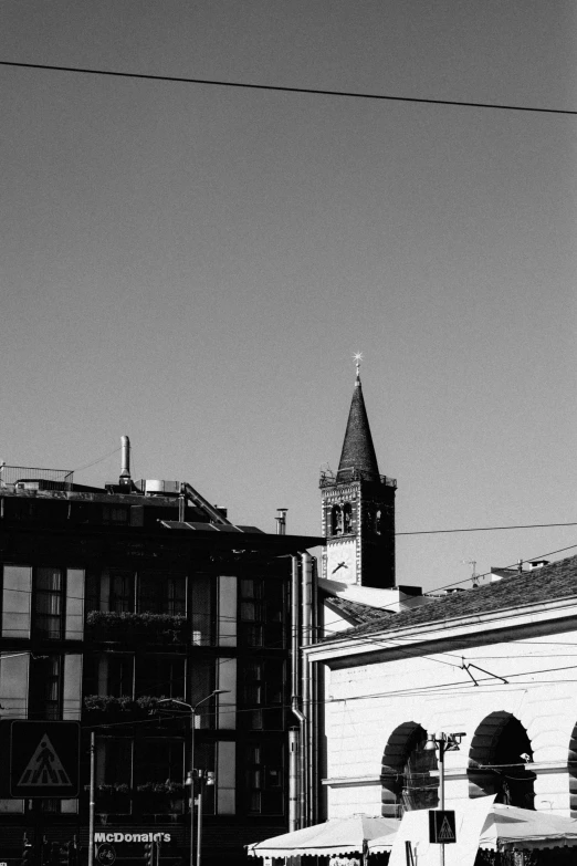 some very tall buildings and a tower in a black and white po