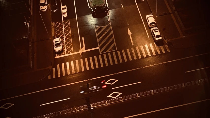 overhead s of intersection on busy city street at night