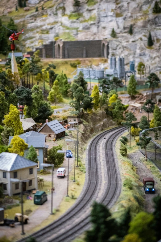 a toy model city is displayed with a train and the track