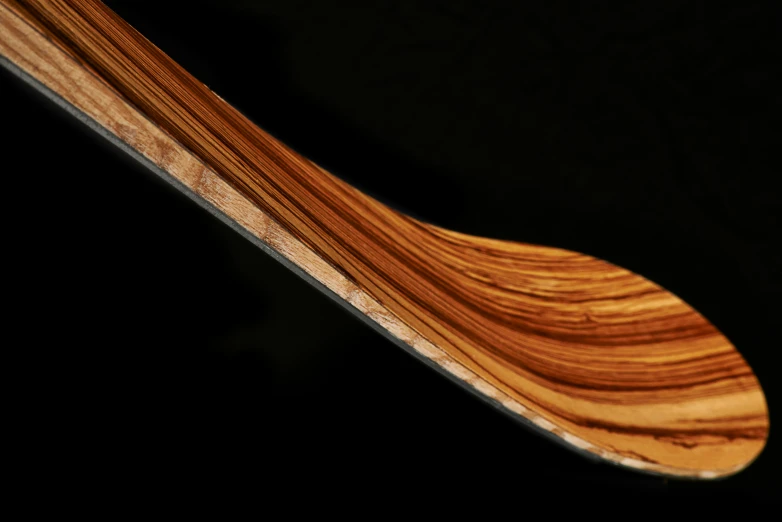 a long wood object with dark background
