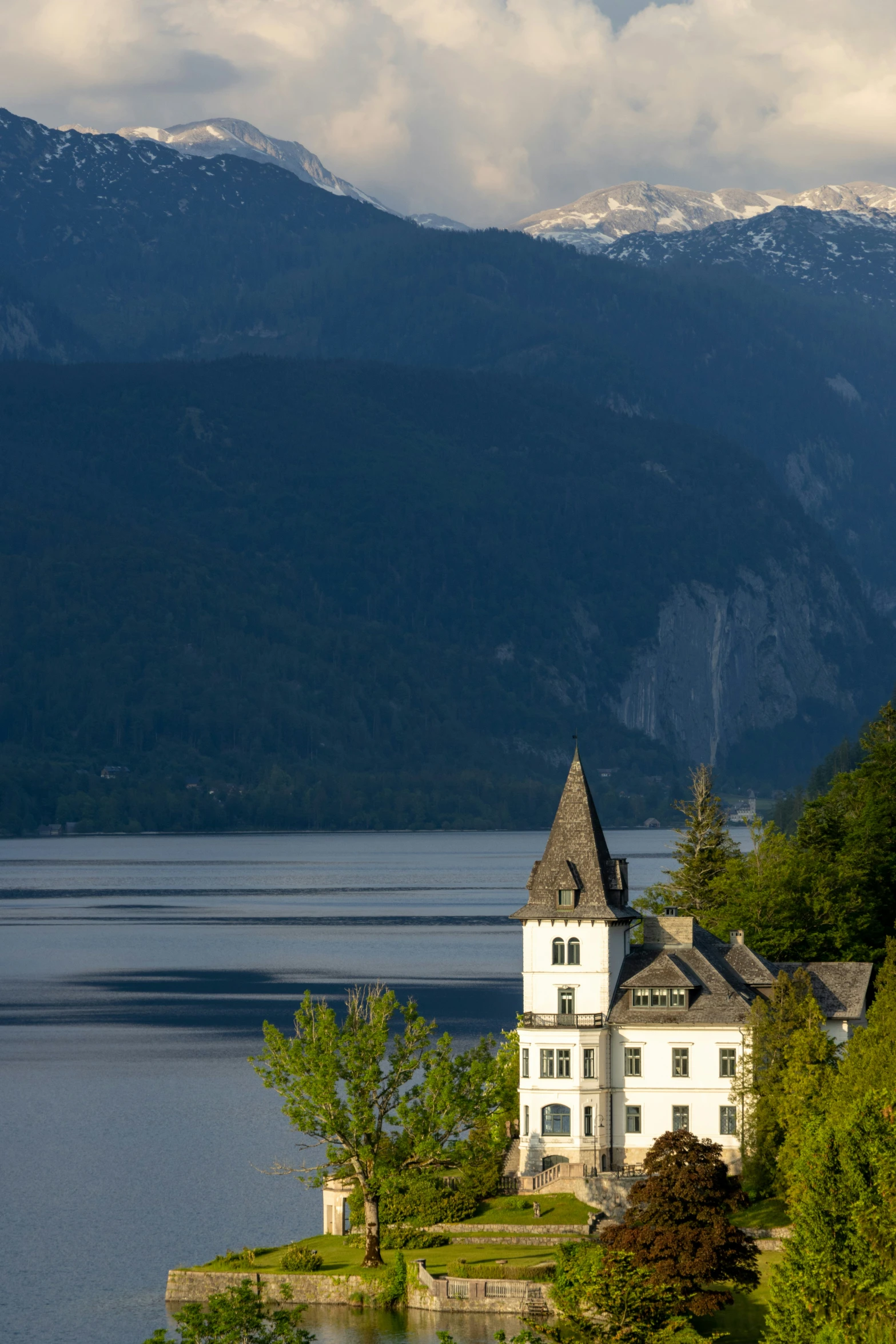 a house on the edge of a body of water