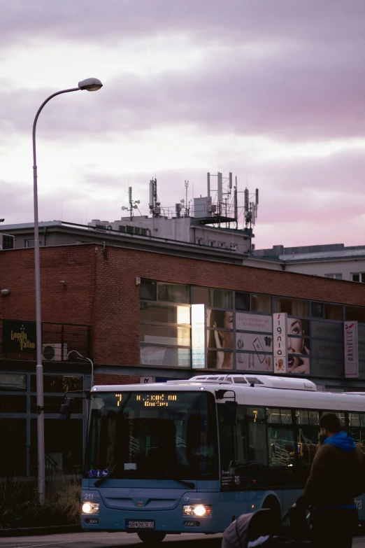 the bus is stopped at a very busy street corner