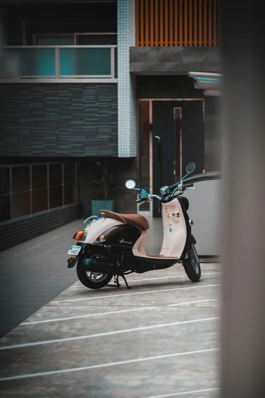 a scooter parked in a parking lot at night