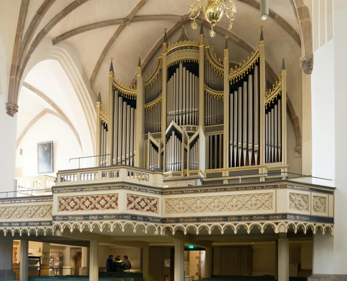 an old organ sitting inside a cathedral