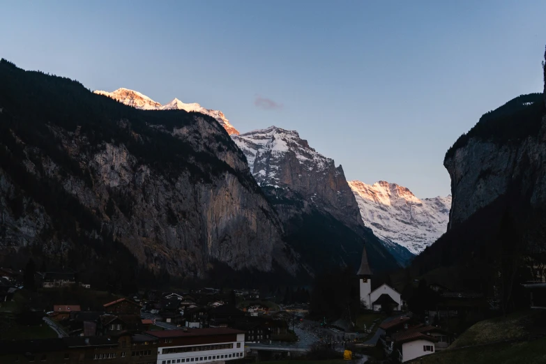 the view of a village from a mountain pass