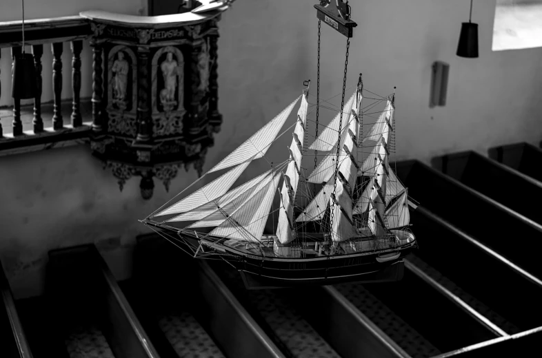 a model ship on a staircase of an old building