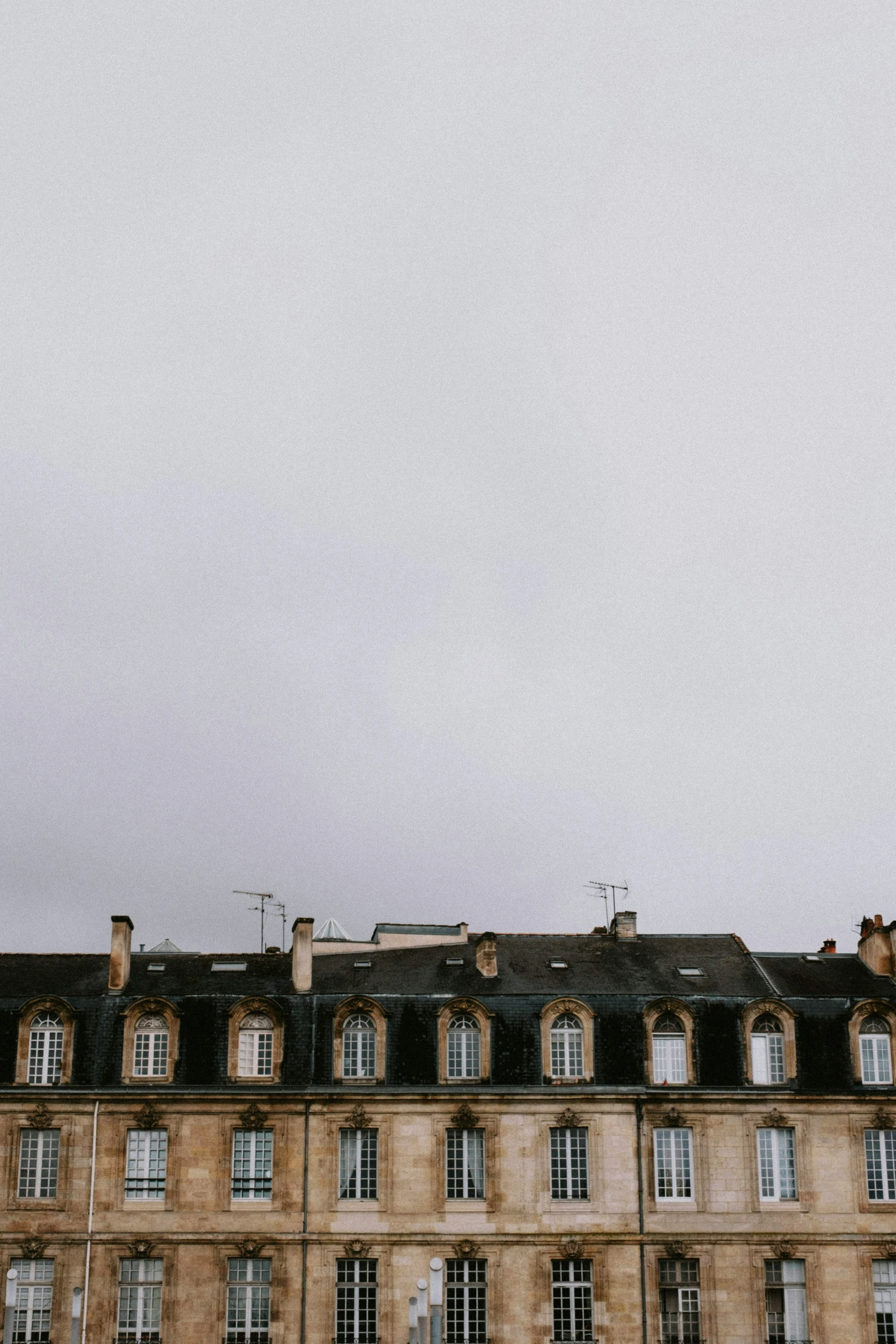 a clock tower is seen in the distance of a building