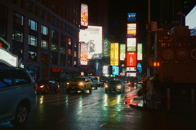 city street with cars and a lot of light signs